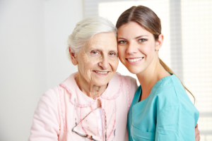 elderly woman with her caregiver